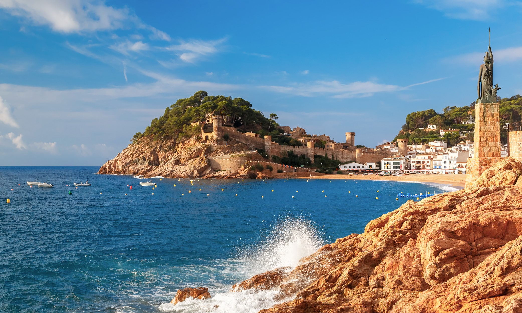 Statue of Minerva overlooking the medieval fort, La Vila Vella, and main beach in Tossa de Mar, Catalunya.