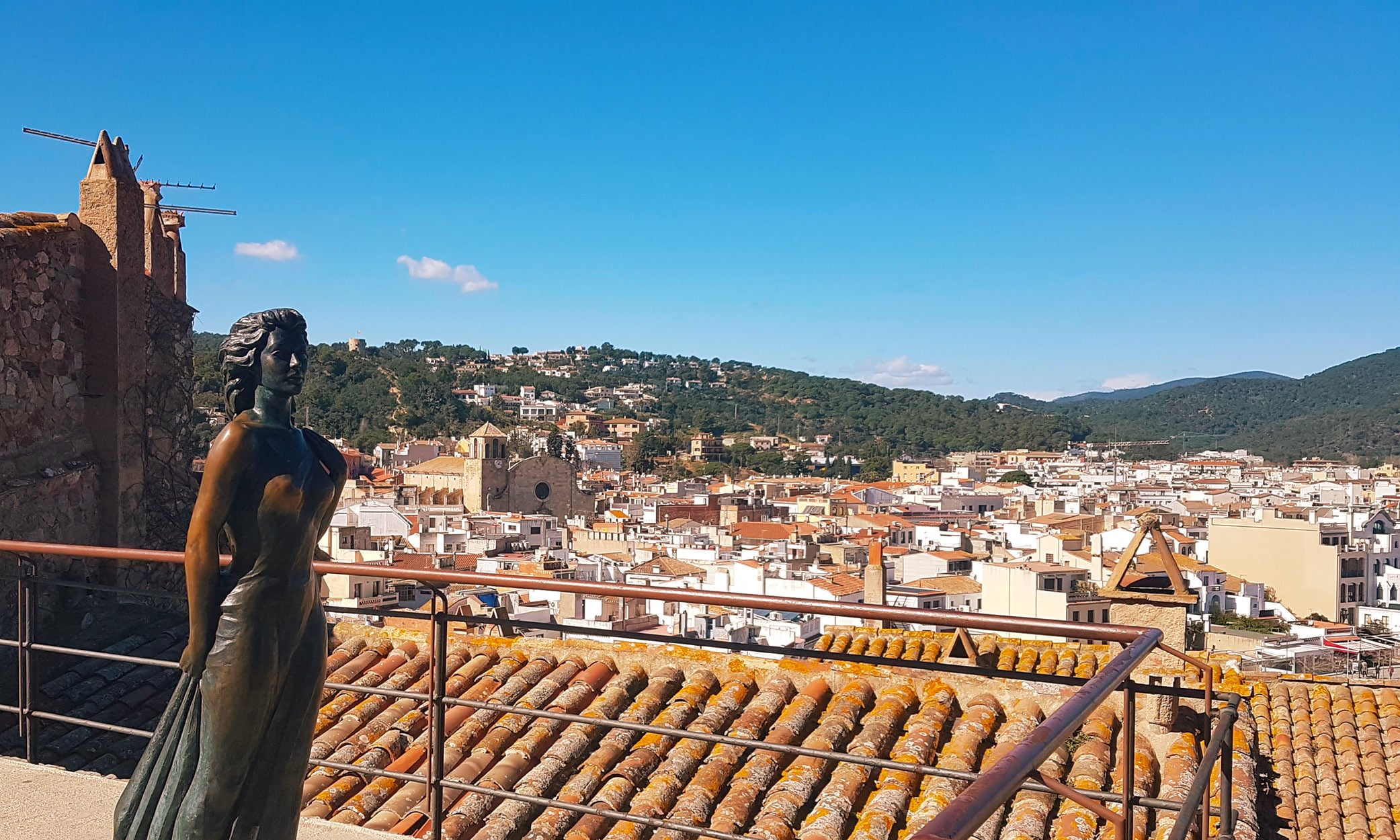 Statue of Ava Gardner overlooking the rooftops and townscape of Tossa de Mar on La Costa Brava, Catalunya.